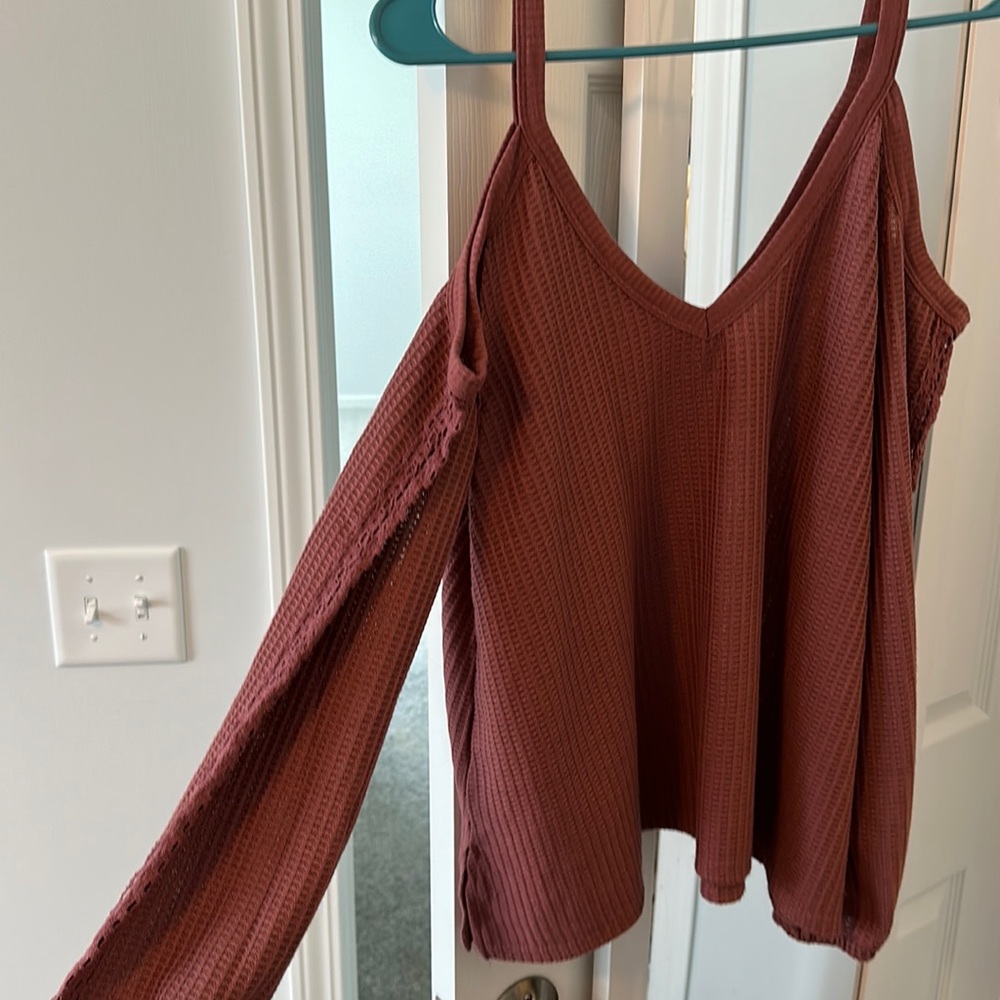Long sleeved top with cut out shoulders